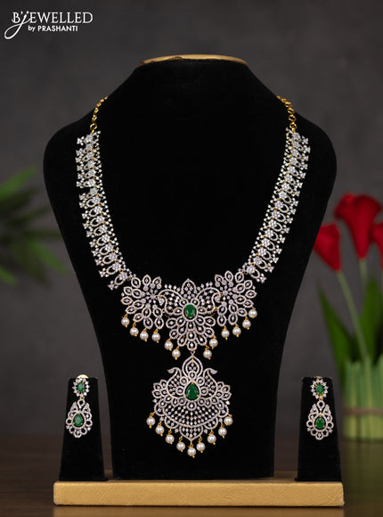 Zircon double layer haaram with emerald & cz stones and pearl hangings in gold finish