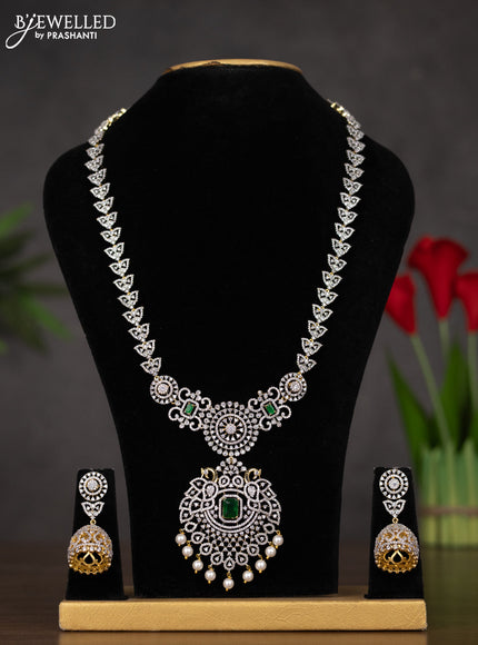 Zircon haaram with emerald & cz stones and pearl hangings in gold finish