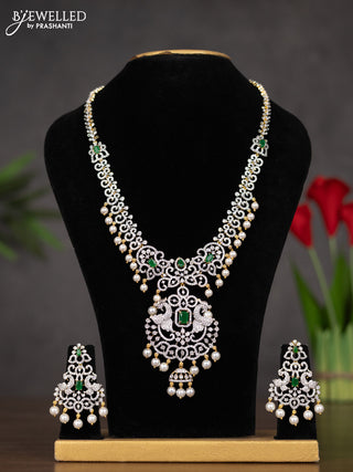 Zircon haaram peacock design with emerald & cz stones and pearl hangings in gold finish