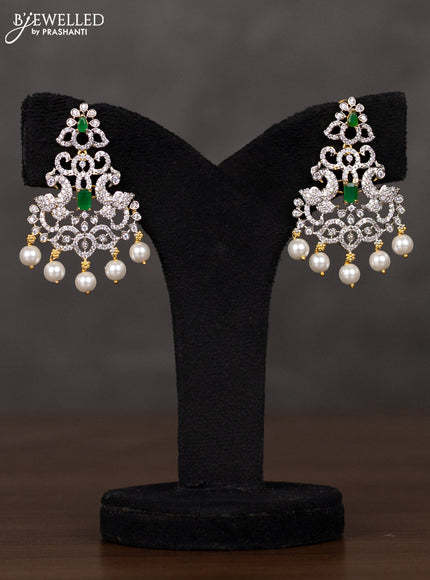 Zircon haaram peacock design with emerald & cz stones and pearl hangings in gold finish