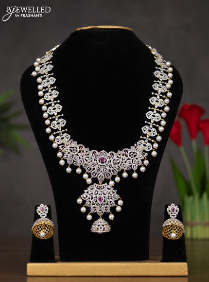 Zircon haaram with ruby & cz stones and pearl hangings in gold finish
