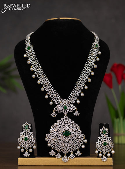 Zircon haaram with emerald & cz stones and pearl hangings in gold finish