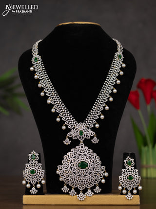 Zircon haaram with emerald & cz stones and pearl hangings in gold finish