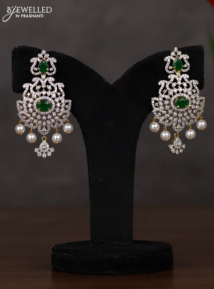 Zircon haaram with emerald & cz stones and pearl hangings in gold finish
