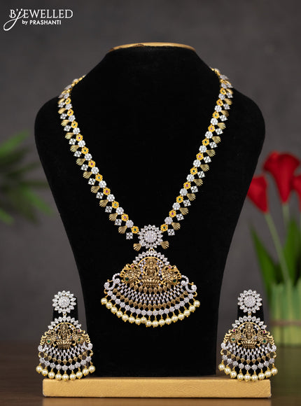 Zircon haaram lakshmi design with kemp & cz stones and pearl hangings in gold finish