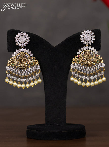 Zircon haaram lakshmi design with kemp & cz stones and pearl hangings in gold finish