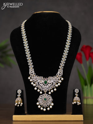 Zircon haaram with emerald & cz stones and pearl hangings in gold finish