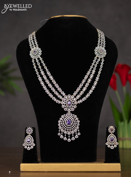 Zircon haaram with purple & cz stones and pearl hangings in gold finish