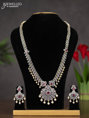 Zircon haaram with ruby & cz stones and pearl hangings in gold finish