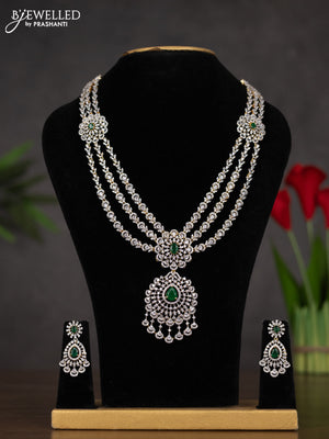 Zircon triple layer haaram with emerald and cz stones in gold finish