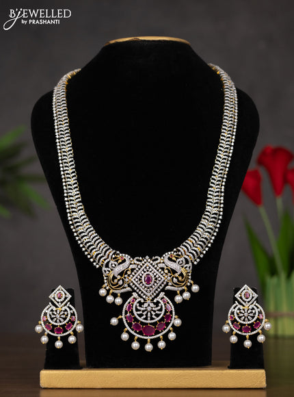 Zircon haaram with ruby & cz stones and pearl hangings in gold finish