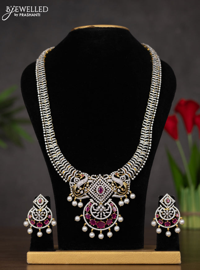Zircon haaram with ruby & cz stones and pearl hangings in gold finish