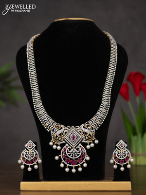 Zircon haaram with ruby & cz stones and pearl hangings in gold finish