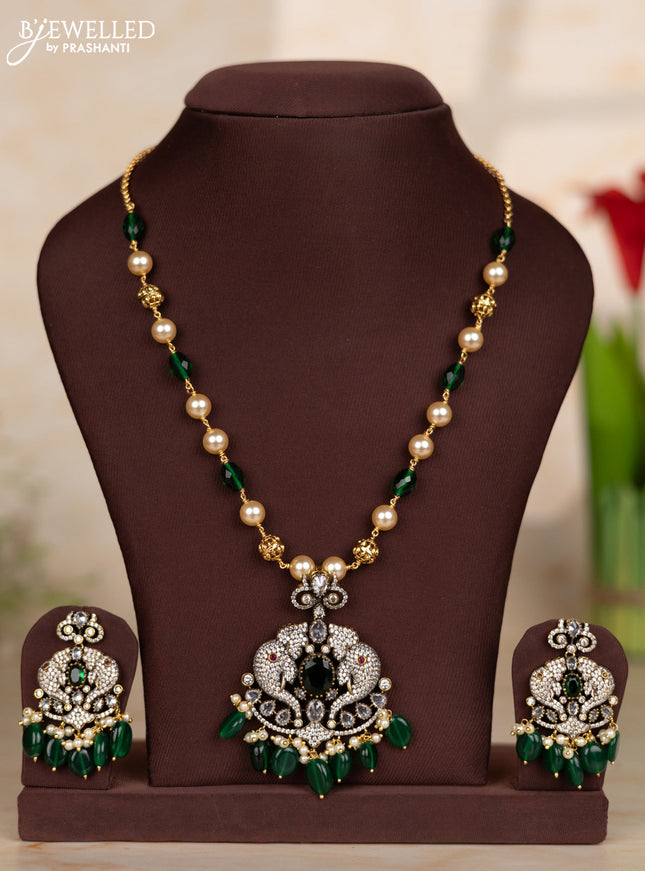 Beaded green necklace with elephant design pendant in victorian finish