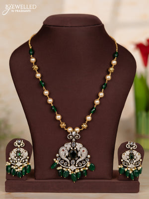 Beaded green necklace with elephant design pendant in victorian finish