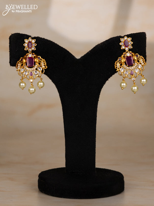 Beaded maroon necklace with double peacock design in white and ruby stones and pearl hanging