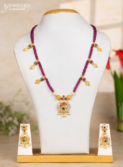 Beaded pink necklace with coin and peacock pendant in kemp and pearl hanging