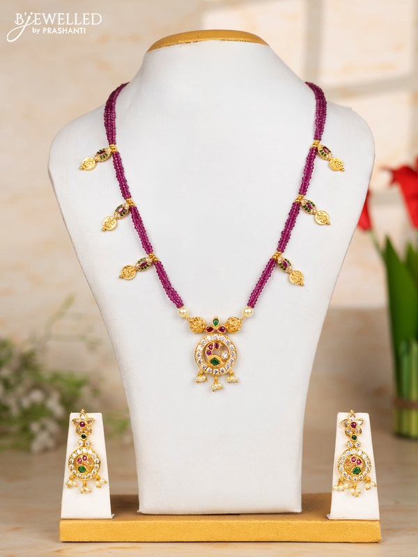 Beaded pink necklace with coin and peacock pendant in kemp and pearl hanging