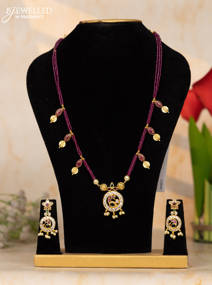Beaded pink necklace with coin and peacock pendant in kemp and pearl hanging