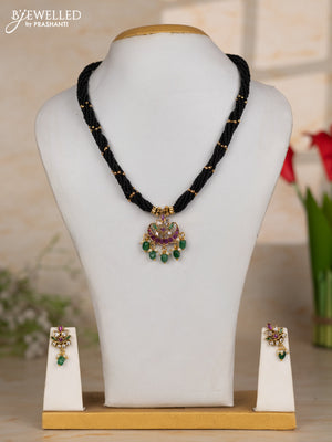 Beaded black necklace with chandbali pendant in kemp and green beads hanging