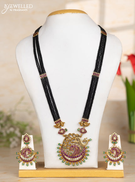 Beaded black necklace peacock pendant in kemp and green beads