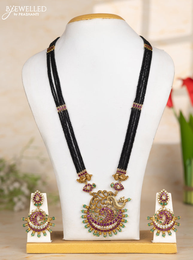 Beaded black necklace peacock pendant in kemp and green beads