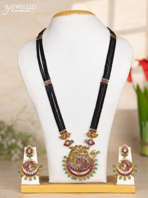 Beaded black necklace peacock pendant in kemp and green beads
