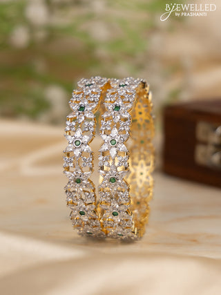 Zircon bangles floral design with emerald and cz stones in gold finish
