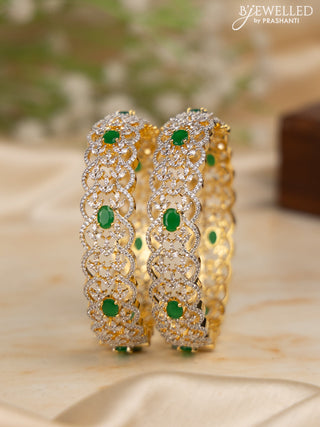 Zircon bangles with emerald and cz stones in gold finish