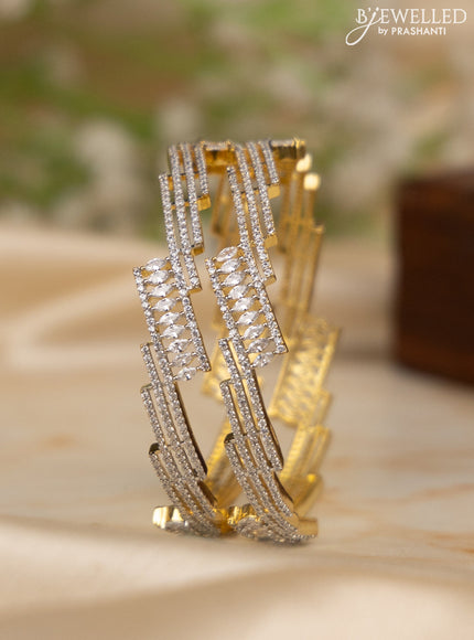 Zircon bangles with cz stones in gold finish