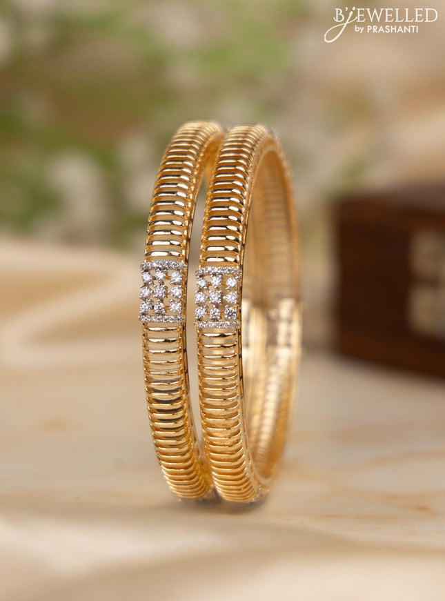 Zircon bangles with cz stones in gold finish
