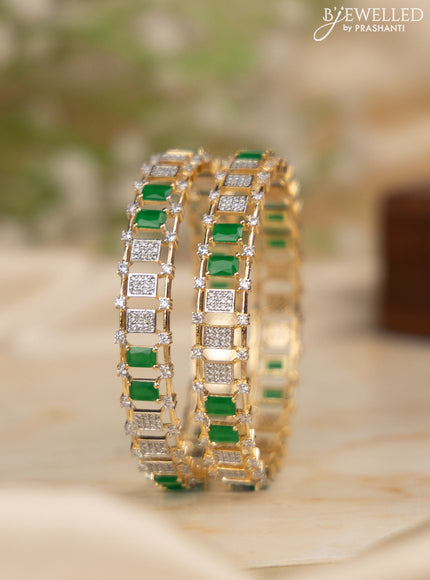Zircon bangles with emerald and cz stones in gold finish