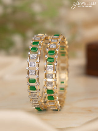 Zircon bangles with emerald and cz stones in gold finish