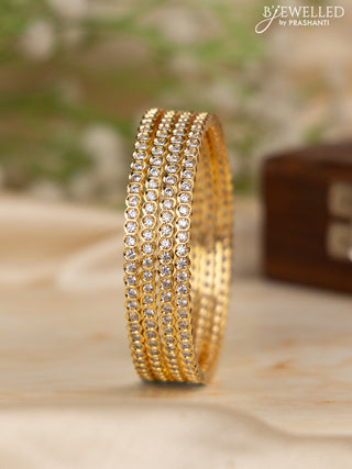 Zircon bangles with cz stones in gold finish