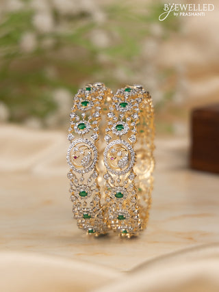 Zircon bangles with emerald and cz stones in gold finish