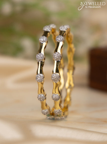 Zircon bangles with cz stones in gold finish