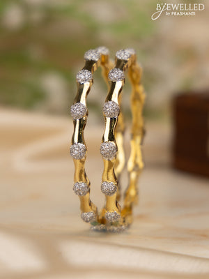Zircon bangles with cz stones in gold finish