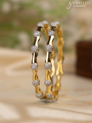 Zircon bangles with cz stones in gold finish