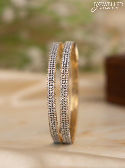 Zircon bangles with cz stones in gold finish