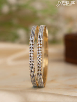 Zircon bangles with cz stones in gold finish