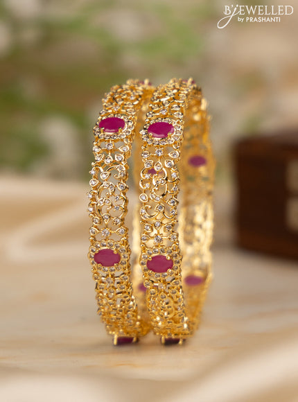 Zircon bangles with ruby and cz stones in gold finish
