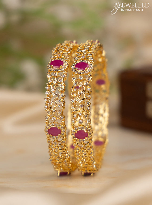 Zircon bangles with ruby and cz stones in gold finish