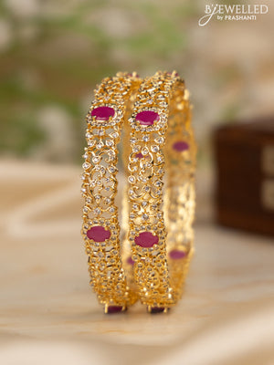 Zircon bangles with ruby and cz stones in gold finish