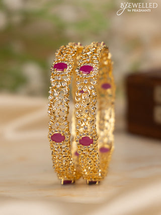 Zircon bangles with ruby and cz stones in gold finish