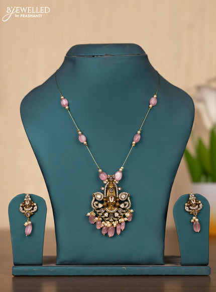Invisible chain tirupati balaji face pendant in pink stones and pink beads hanging