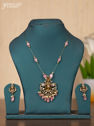 Invisible chain tirupati balaji face pendant in pink stones and pink beads hanging