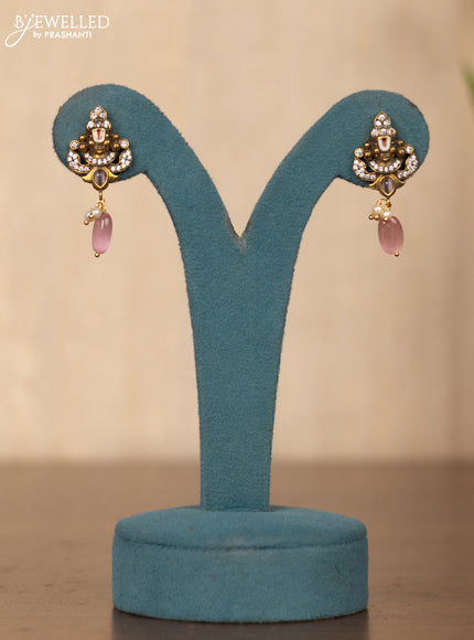 Invisible chain tirupati balaji face pendant in pink stones and pink beads hanging