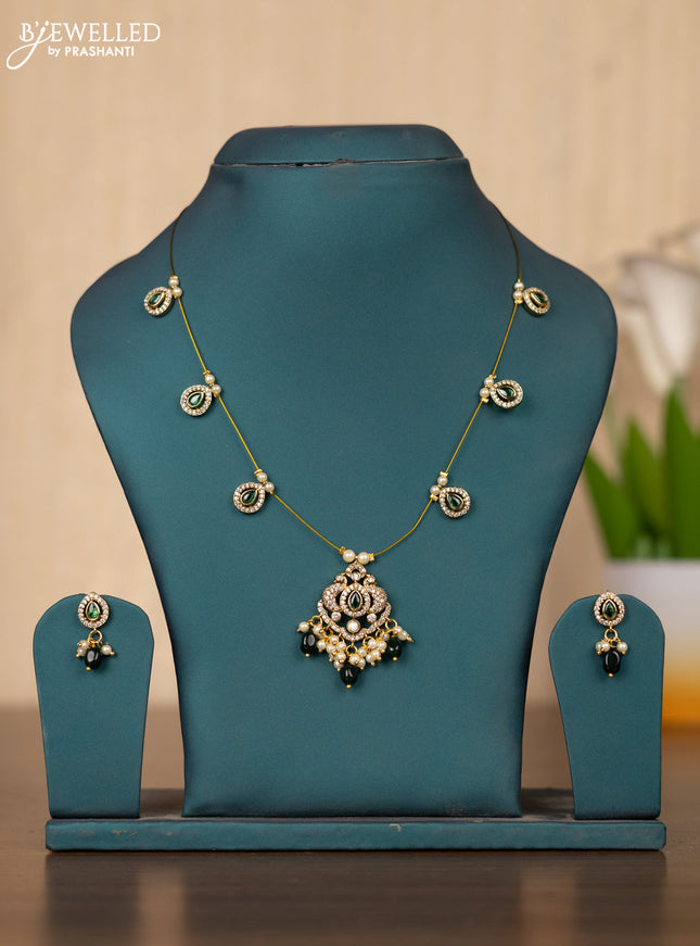 Invisible chain double peacock design in green stones and green beads hanging