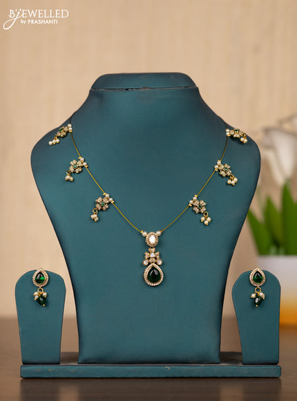 Invisible chain in floral design with green stones
