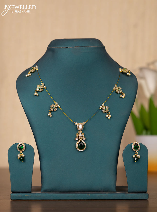 Invisible chain in floral design with green stones